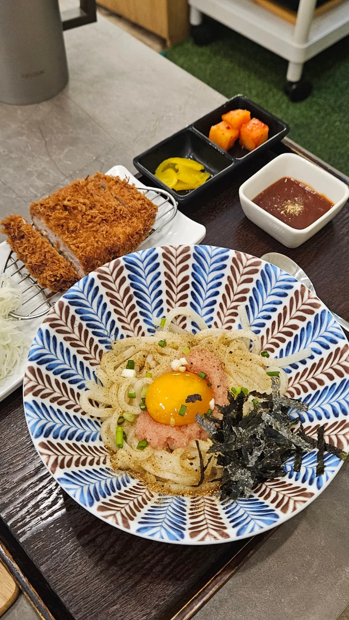 Full spread of the egg sauce pollack roe mixed udon with pork cutlet set