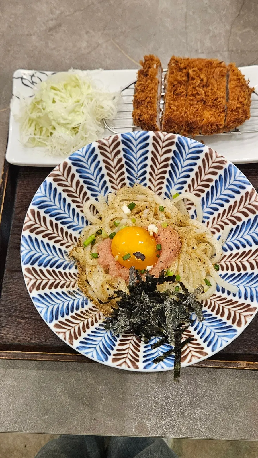 Mixed udon with egg cracked open and blended with pollack roe