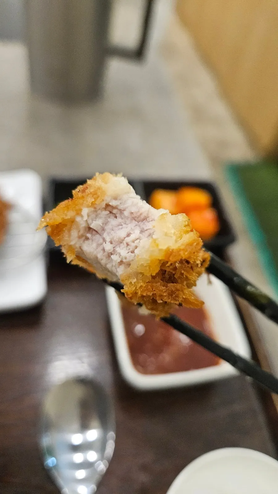 Udon noodles lifted with chopsticks