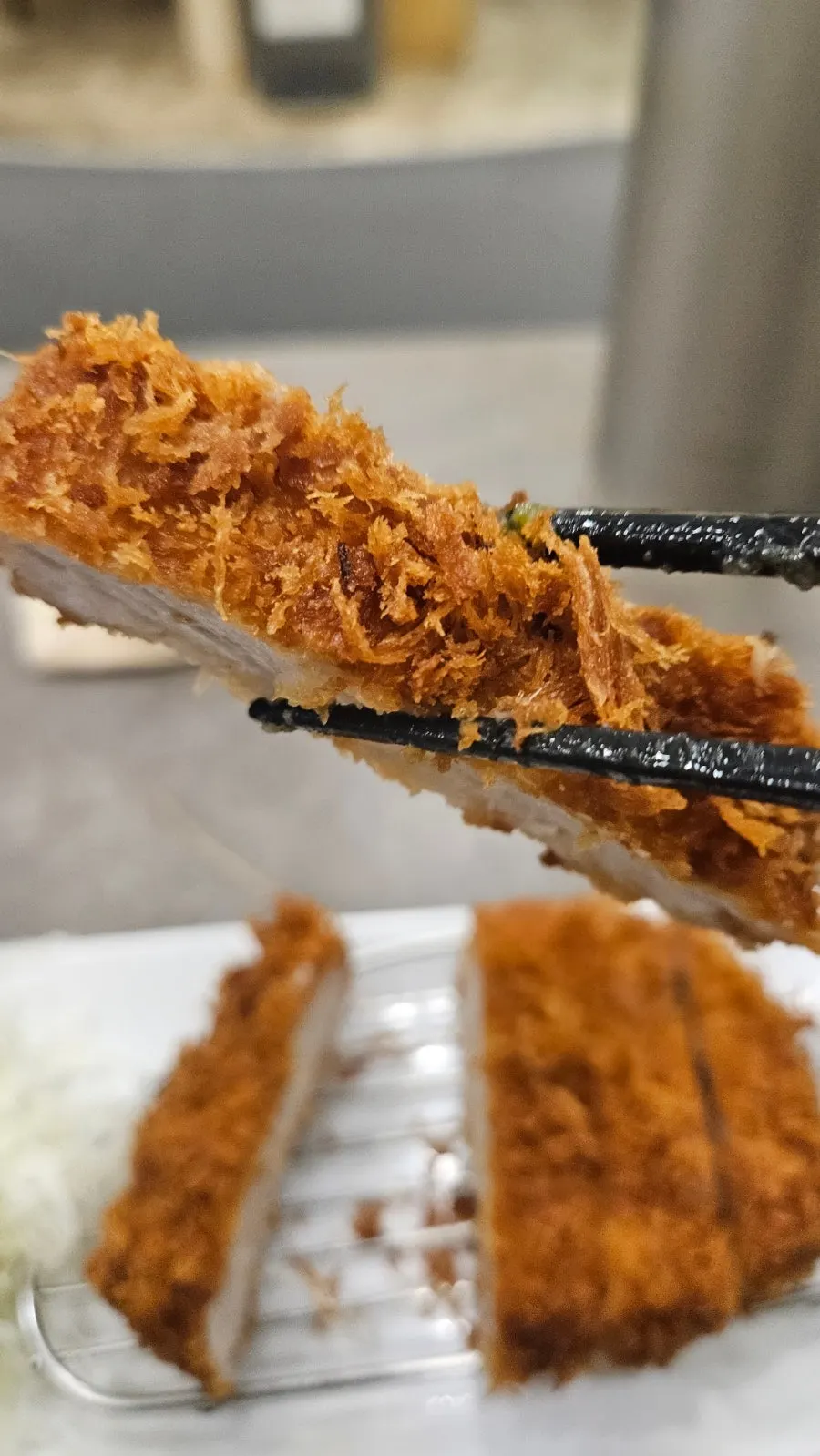 Cross-section of the crispy-battered pork cutlet