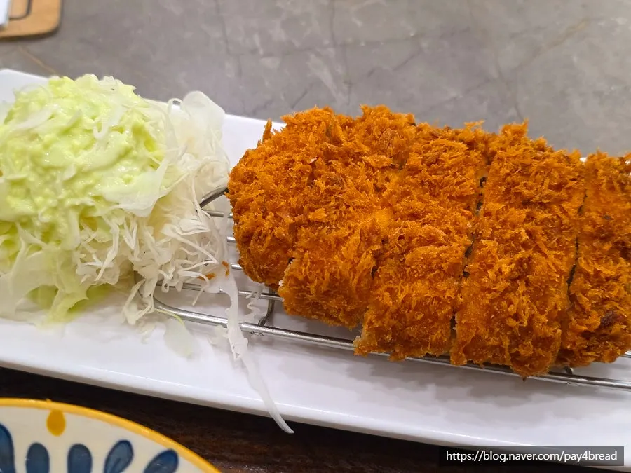 Close-up of the crispy pork cutlet cross-section
