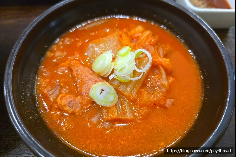 Pork kimchi jjigae served alongside the pork cutlet