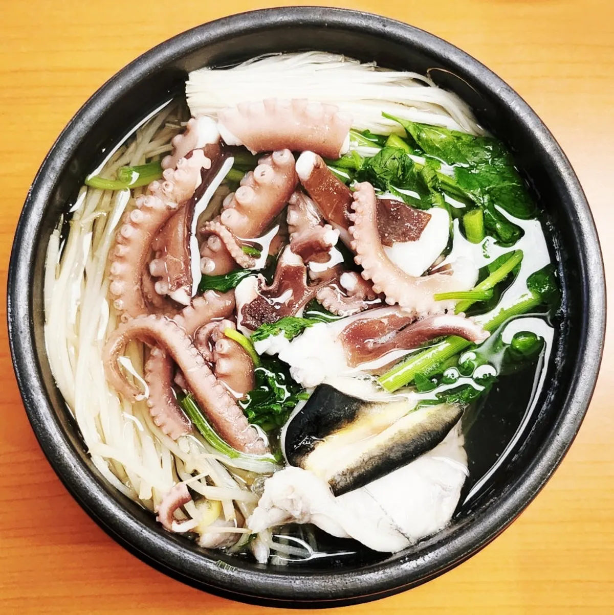 Milbok pufferfish soup with a whole live octopus