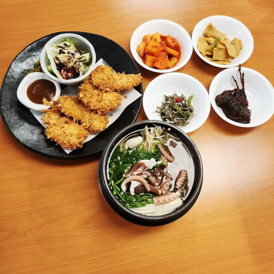 Pufferfish soup topped with prepared live octopus