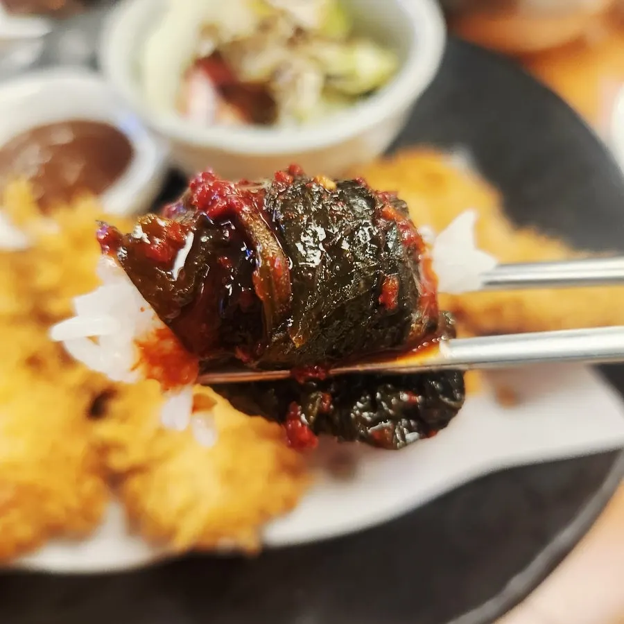 Glossy sticky rice served with the pufferfish soup