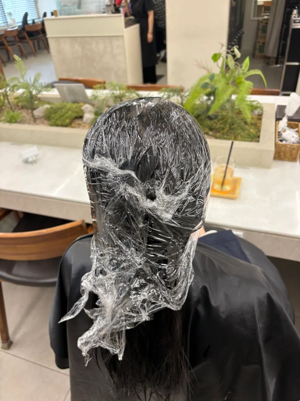Frizzy, curly hair before the straight perm treatment