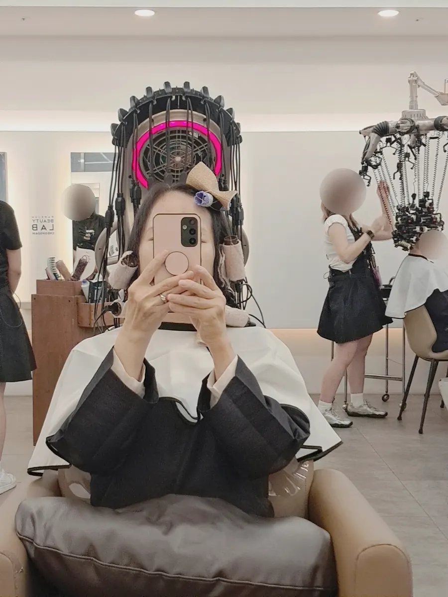 Front view of the finished layered perm with a not-too-strong curl