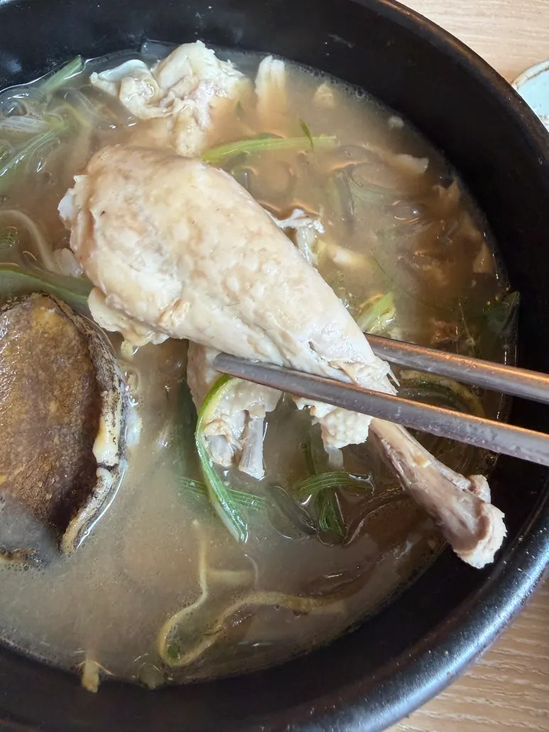 A spread with abalone dakgomtang and whole dakgomtang