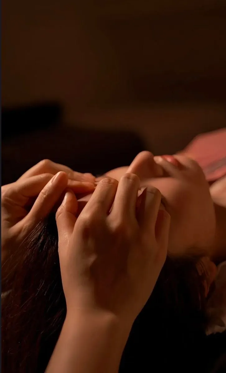 Lying on the treatment bed getting a massage