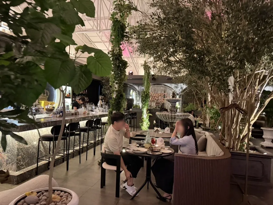 Interior of People the Terrace lit by chandeliers