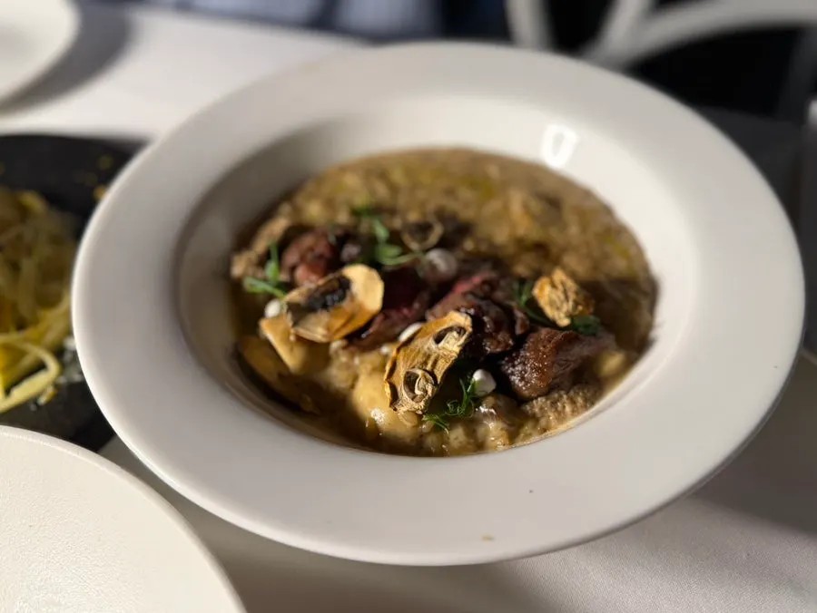 Mushroom cream risotto with Korean beef steak on top