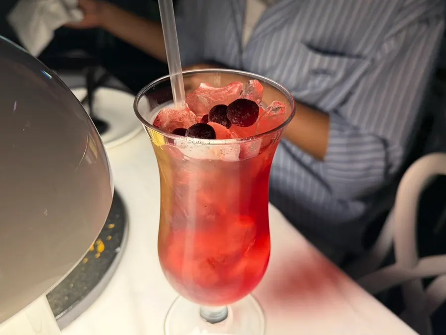 A glass of juice ordered along with the meal
