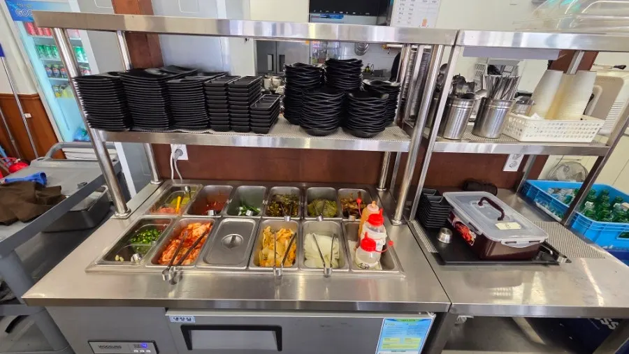 Self-serve banchan bar with side dishes on display