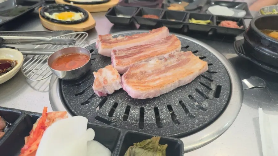 A nicely browned piece of grilled pork belly