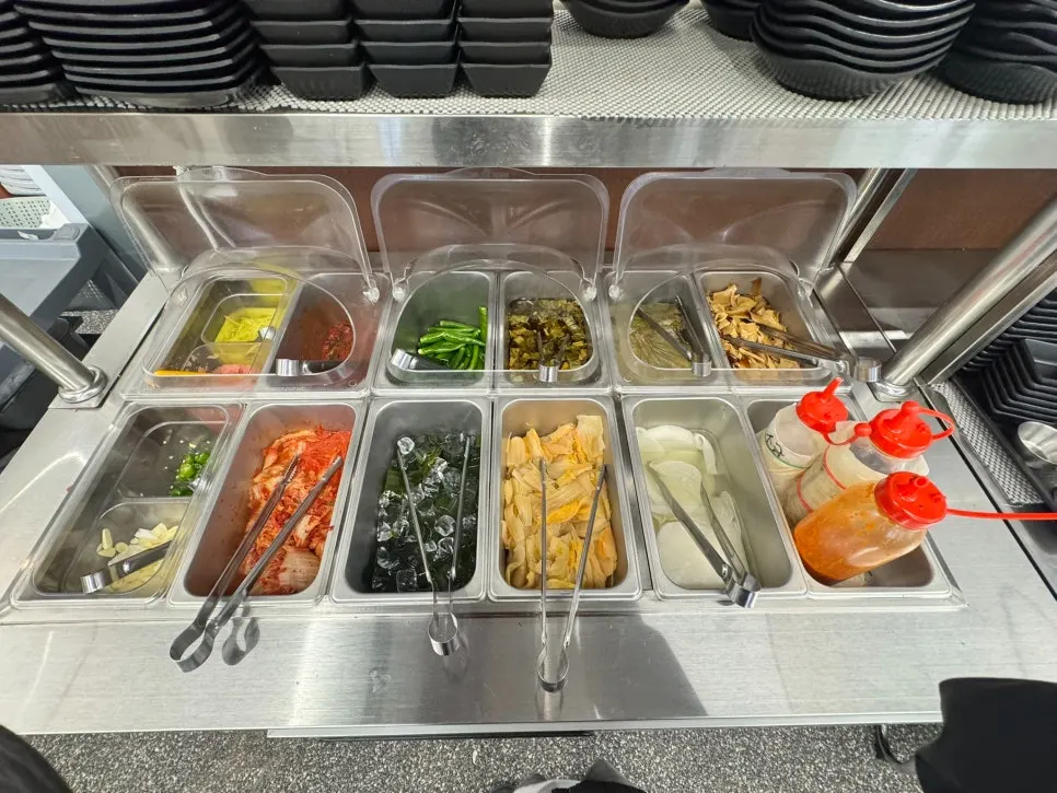 Self-serve bar with side dishes divided by type