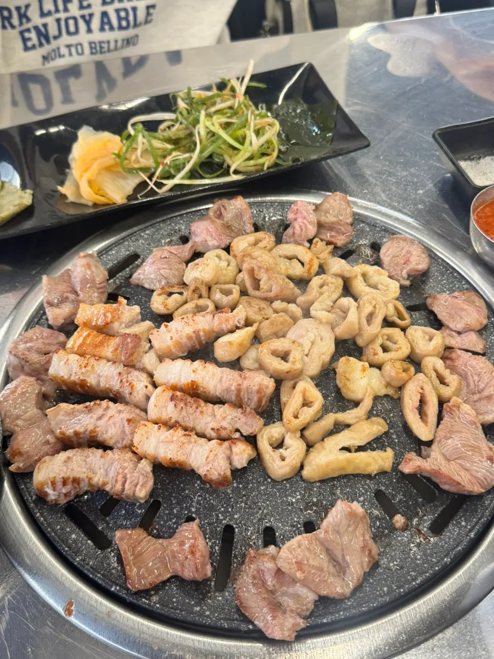 A piece of makchang dipped in soybean powder