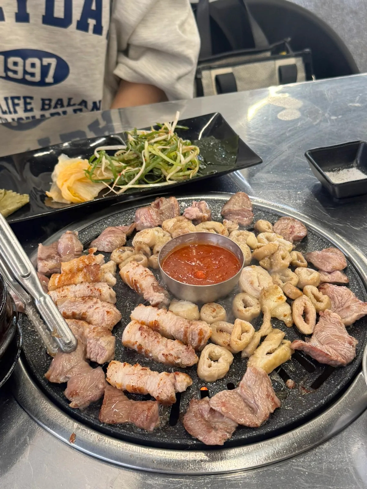 Close-up of the three cuts grilling together