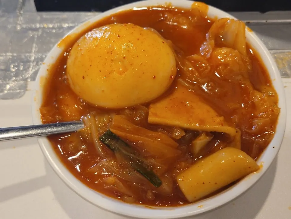 Small plate with rice cake, noodles, fish cake, and egg