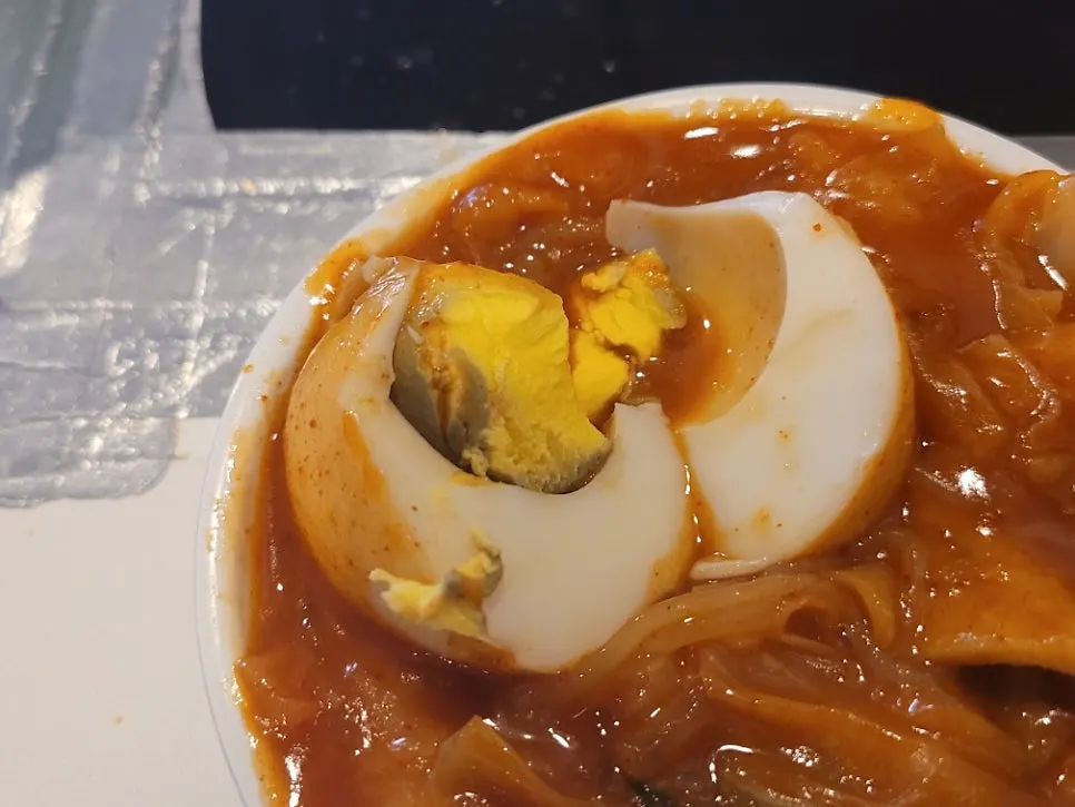 Boiled egg cut in half showing the yolk