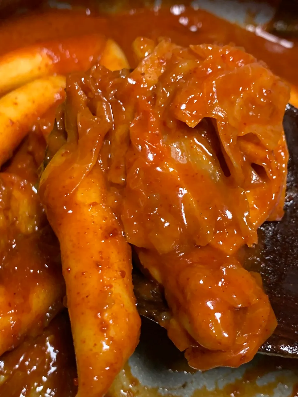 Instant tteokbokki simmering with the powdered sauce added little by little