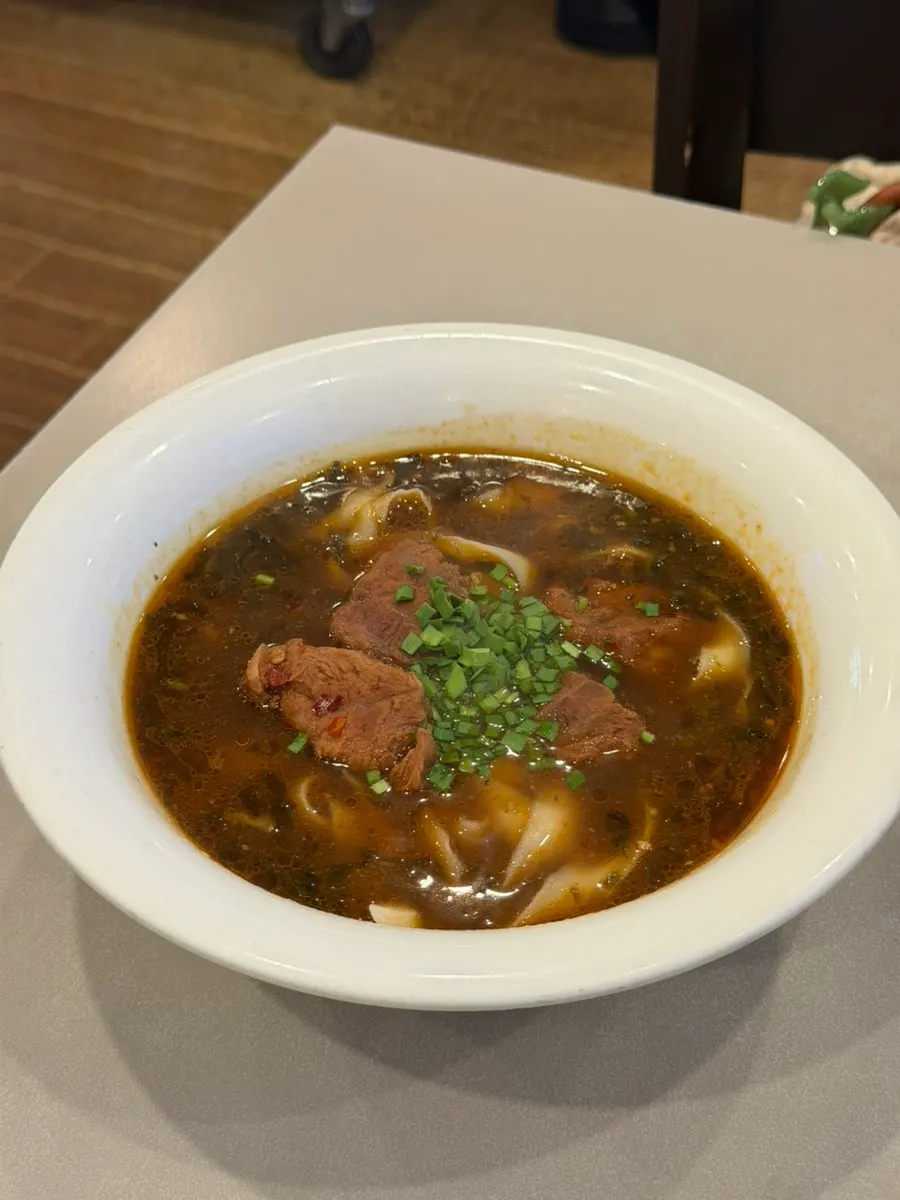 Beef knife-cut noodles topped generously with meat