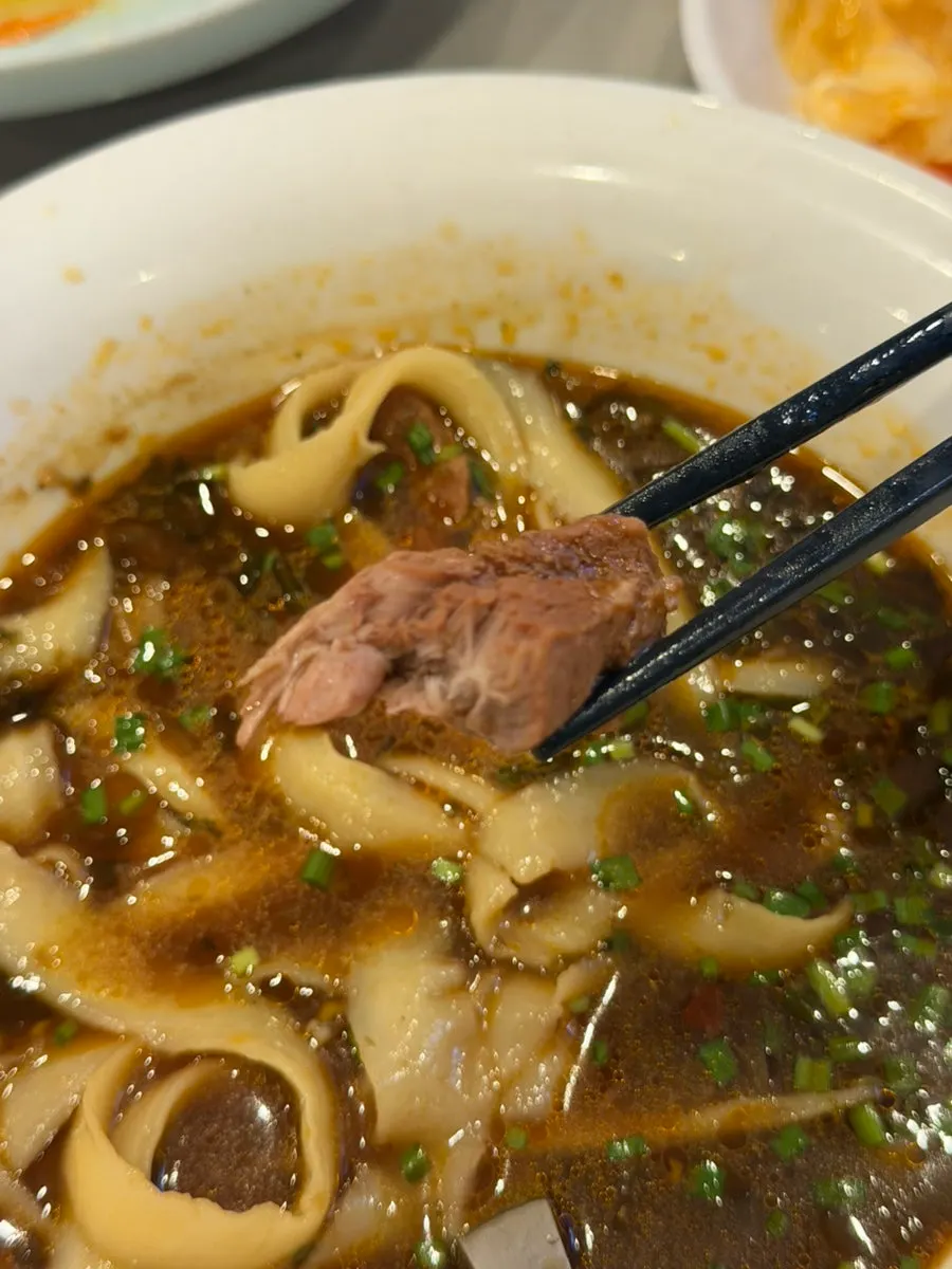 Beef and noodles picked up together