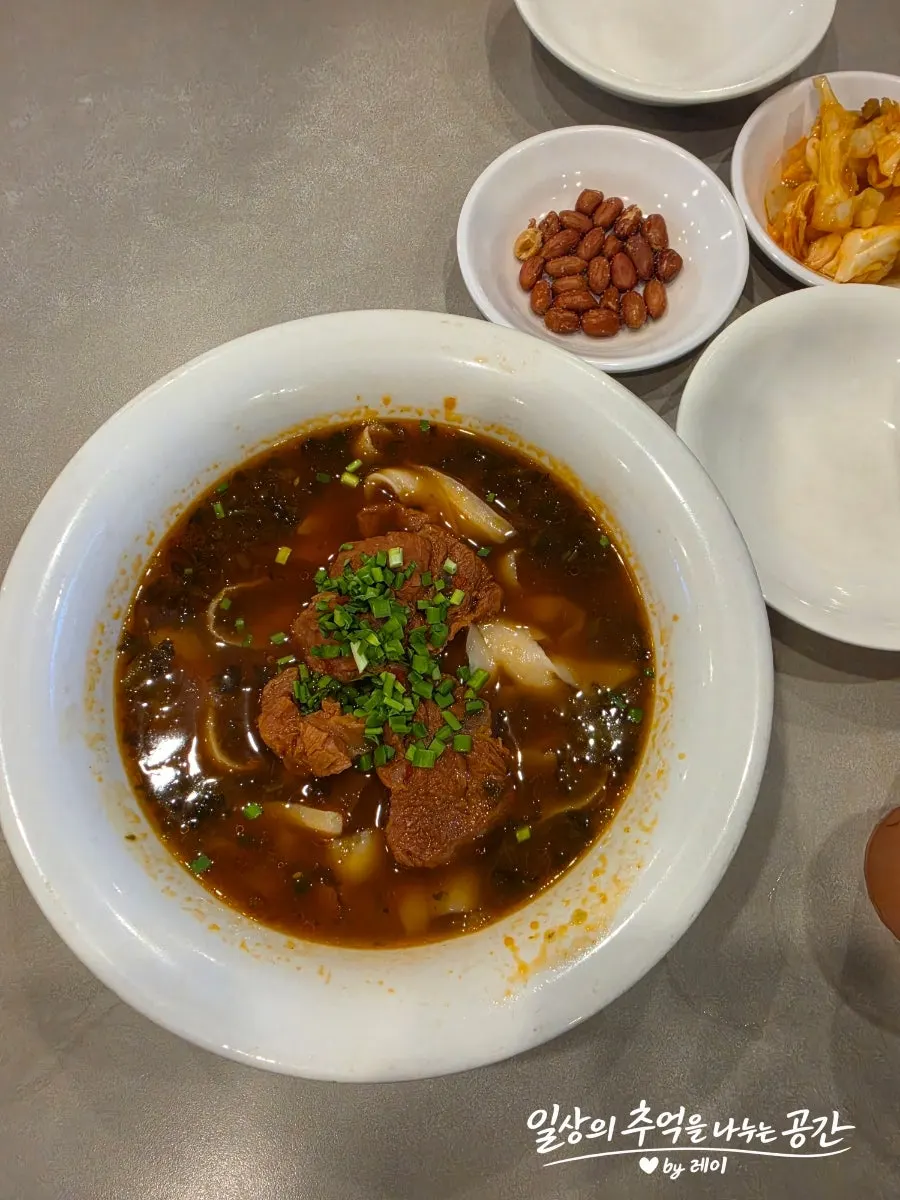 A bowl of beef knife-cut noodles topped with garnish