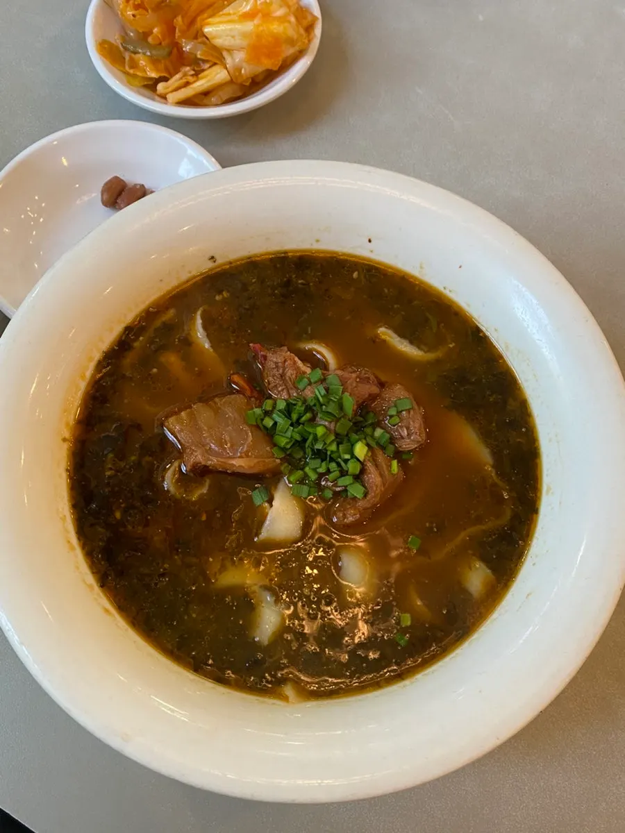 A bowl of basic broth dosakmyeon