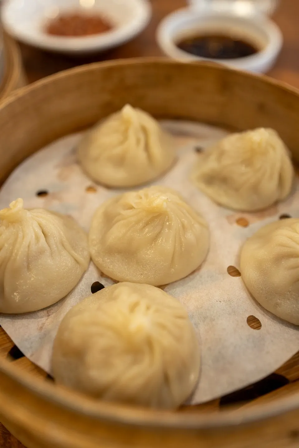 A dumpling picked up with chopsticks