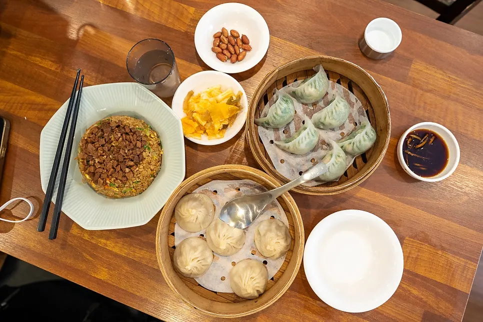 A full table at Cheonghwa Uyuk Dosakmyeon with all three dishes
