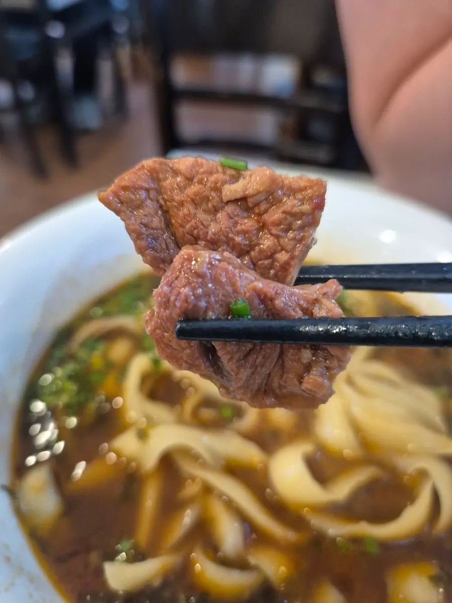 Chewy strands of beef knife-cut noodles
