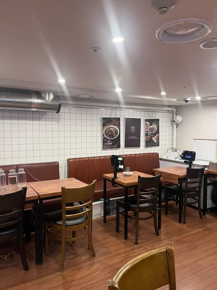 The restaurant interior packed with diners on a weekend evening