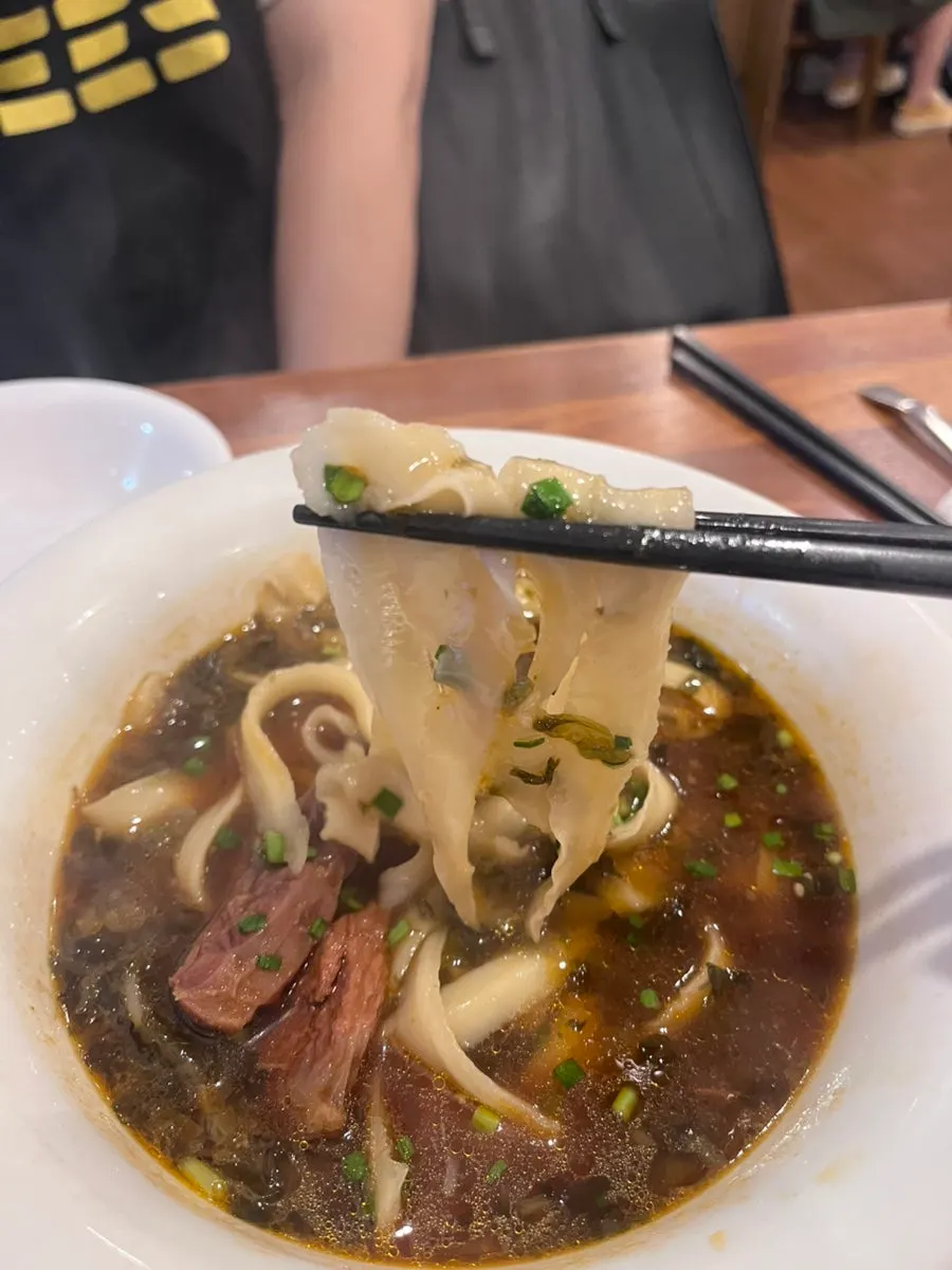 Close-up of the rich broth in the uyuk dosakmyeon