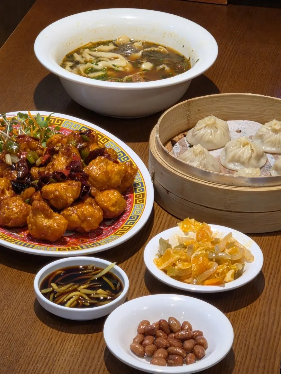 The full spread of three dishes shared by two people