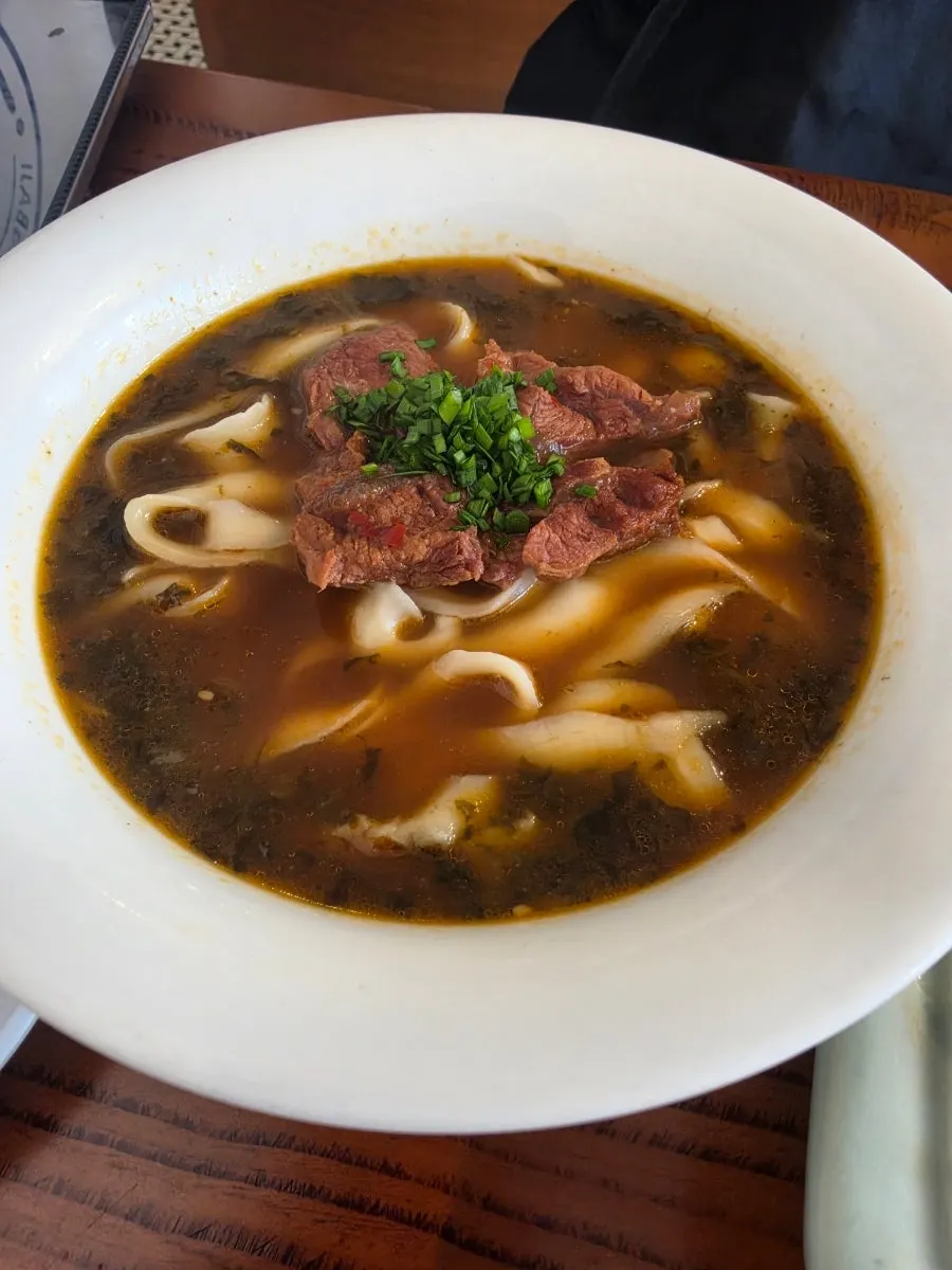 Beef knife-cut noodles topped with generous chunks of meat
