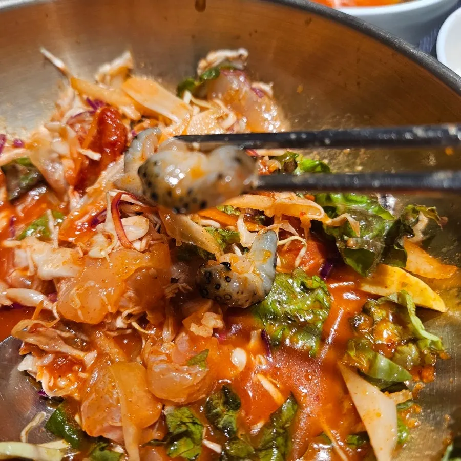 Seafood mulhoe served with somyeon noodles