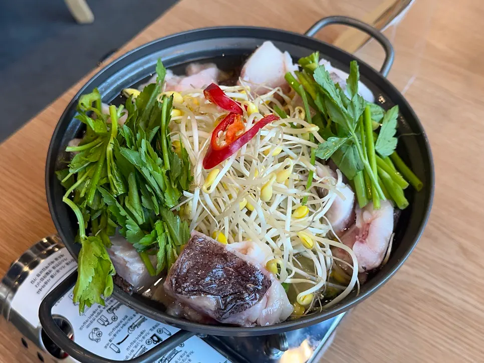Monkfish clear soup with bean sprouts and crown daisy