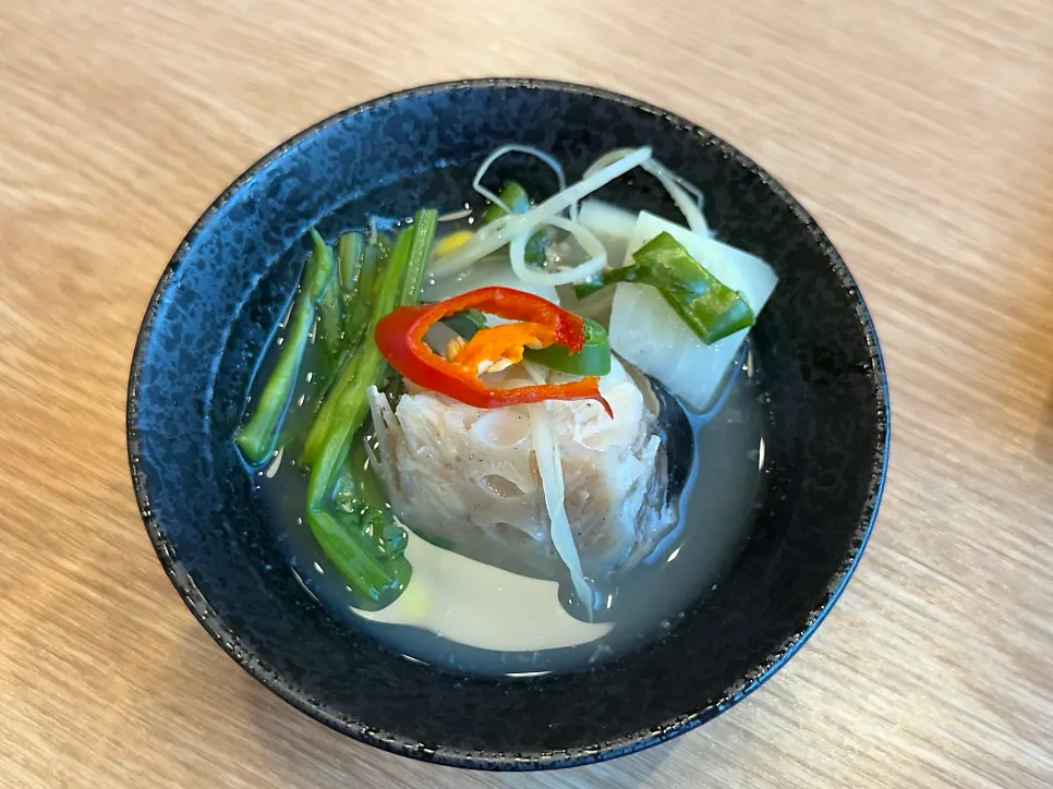 Clear soup with plump monkfish meat