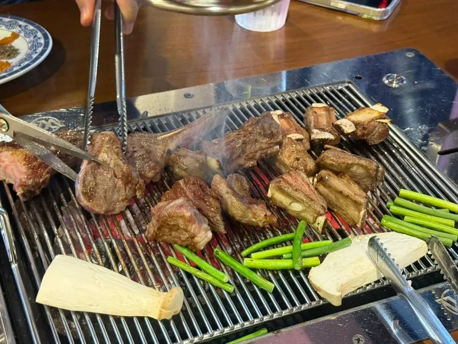 Cross-section of bone-in lamb ribs cut with scissors