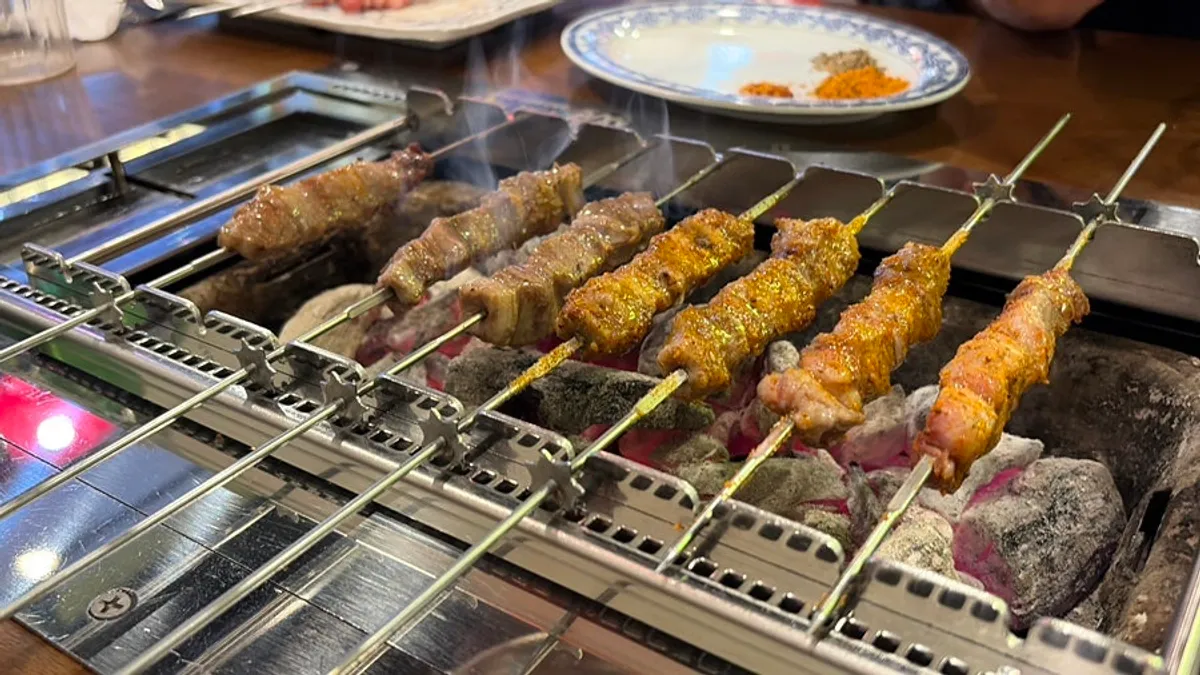 Plain and original lamb skewers on the grill