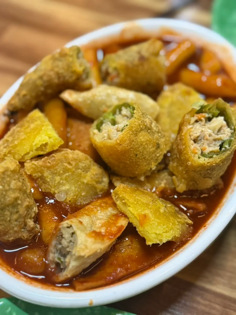 Fried pepper snack sliced open, packed with meat and vegetables
