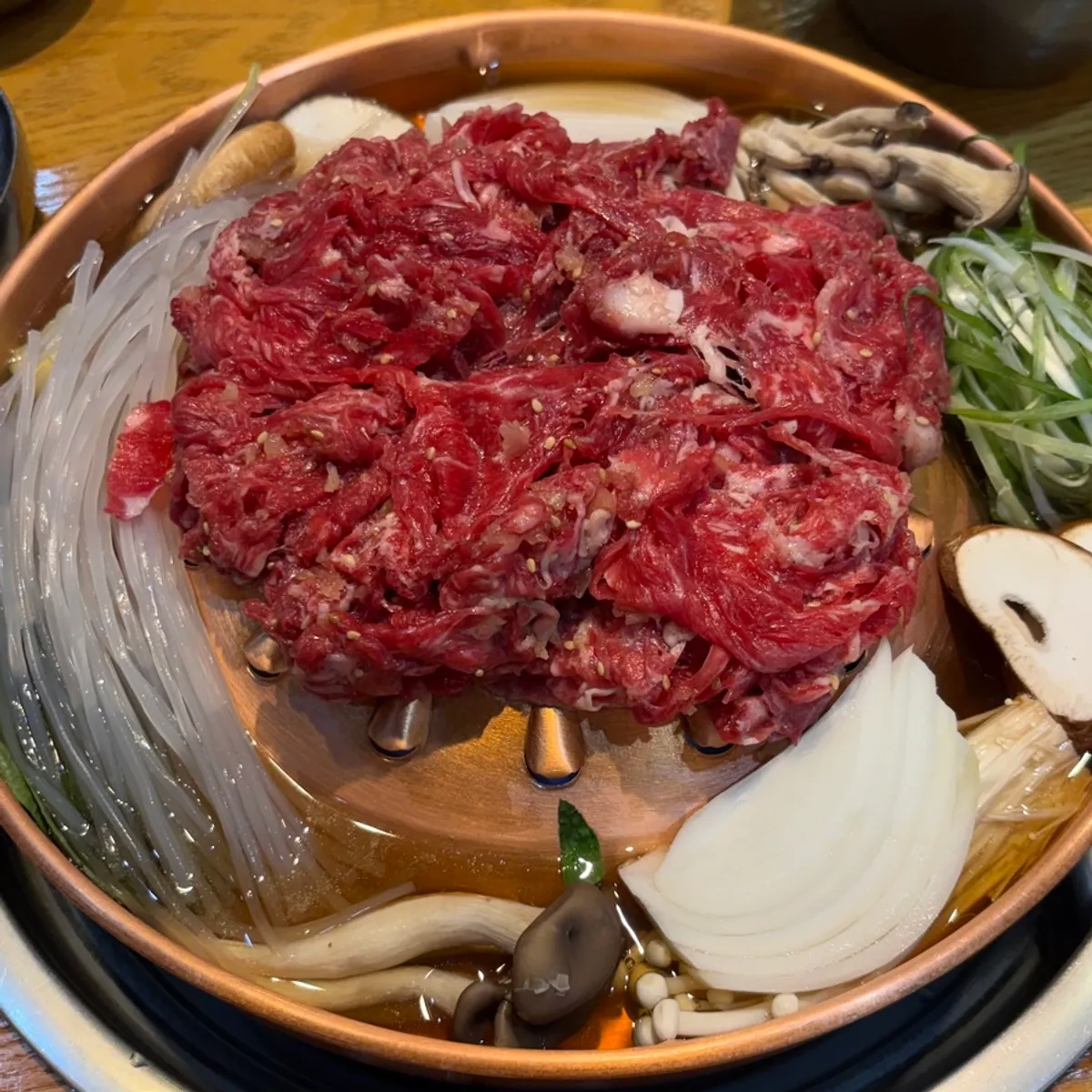 Korean beef fresh bulgogi topped with mushrooms and glass noodles