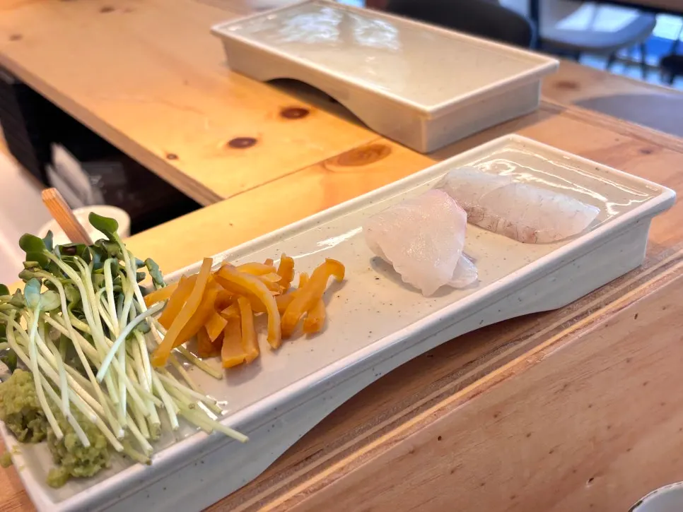 A plate of sashimi served in sequence