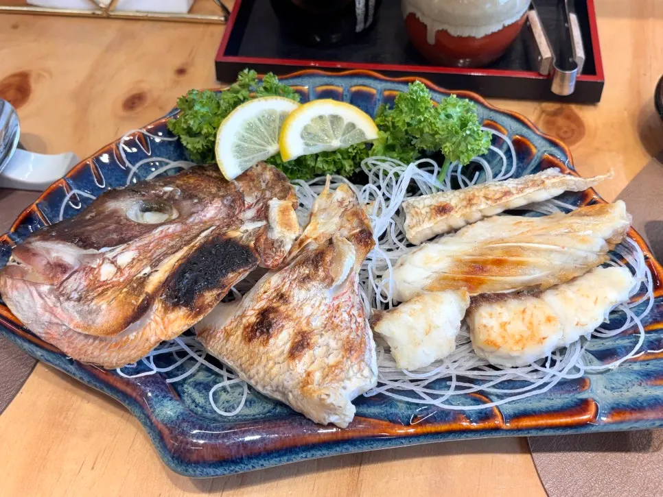 Grilled sea bream head, also sold as a standalone dish