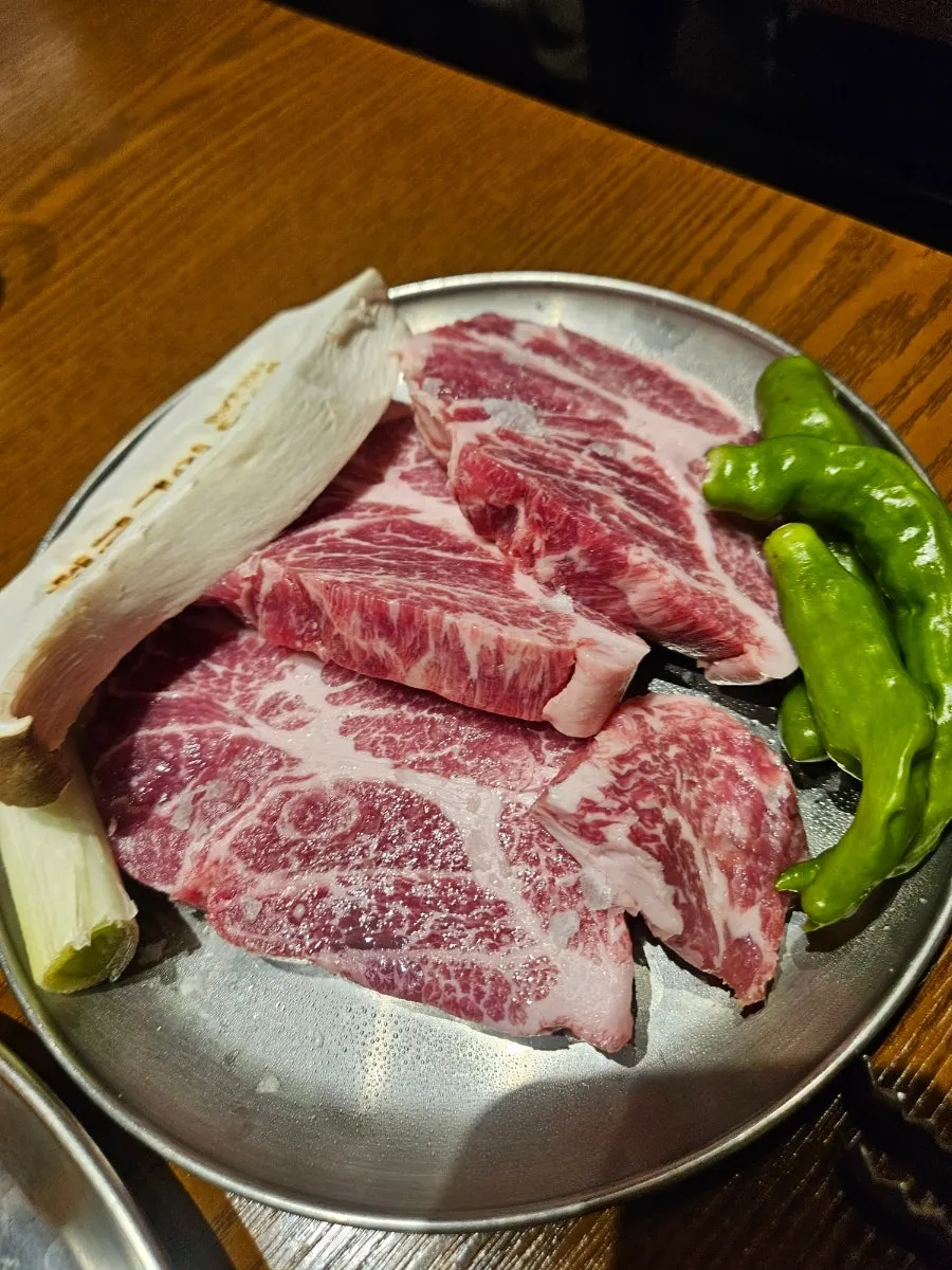 Raw Iberico pork neck on a plate