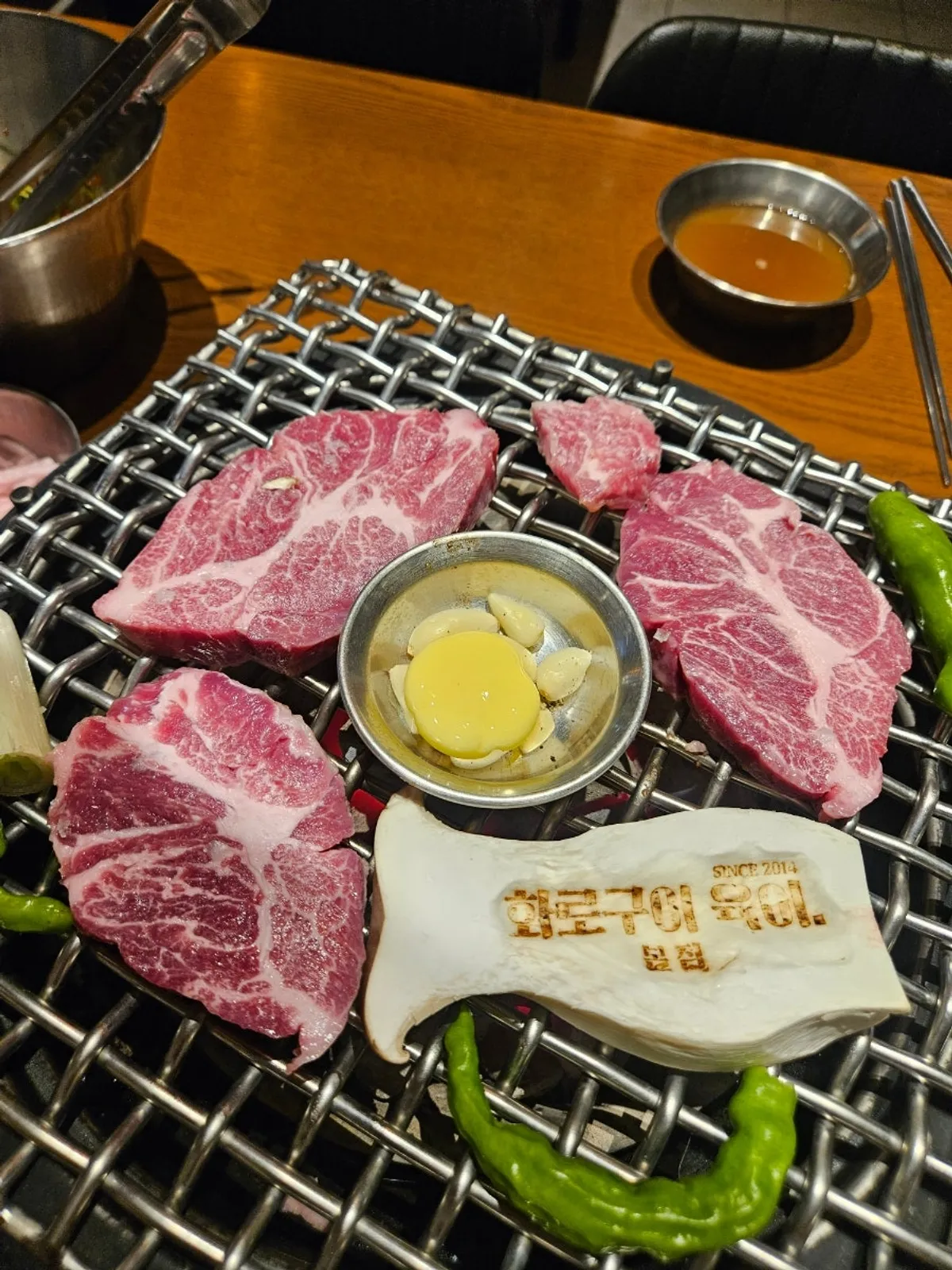 A plate of beef tartare with minari