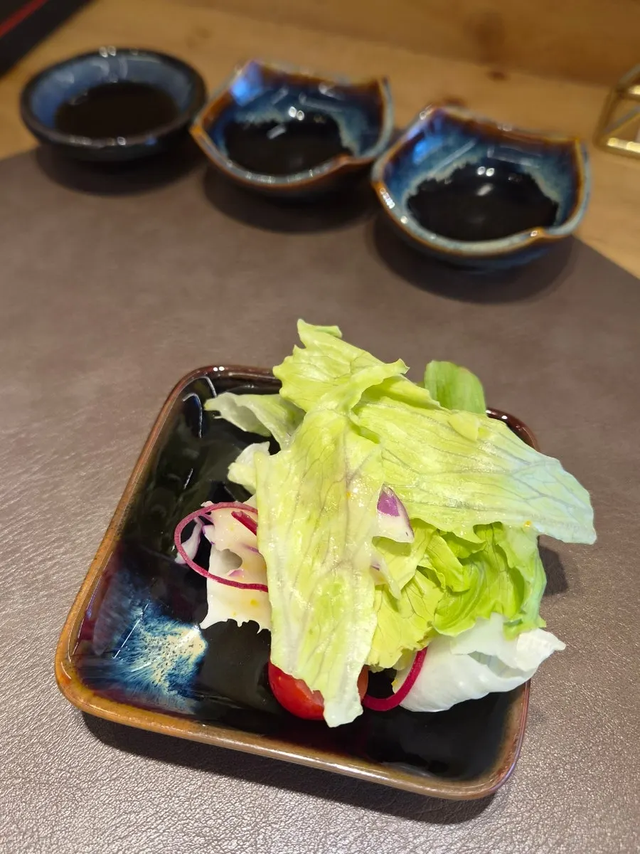 Salad portioned onto a small plate