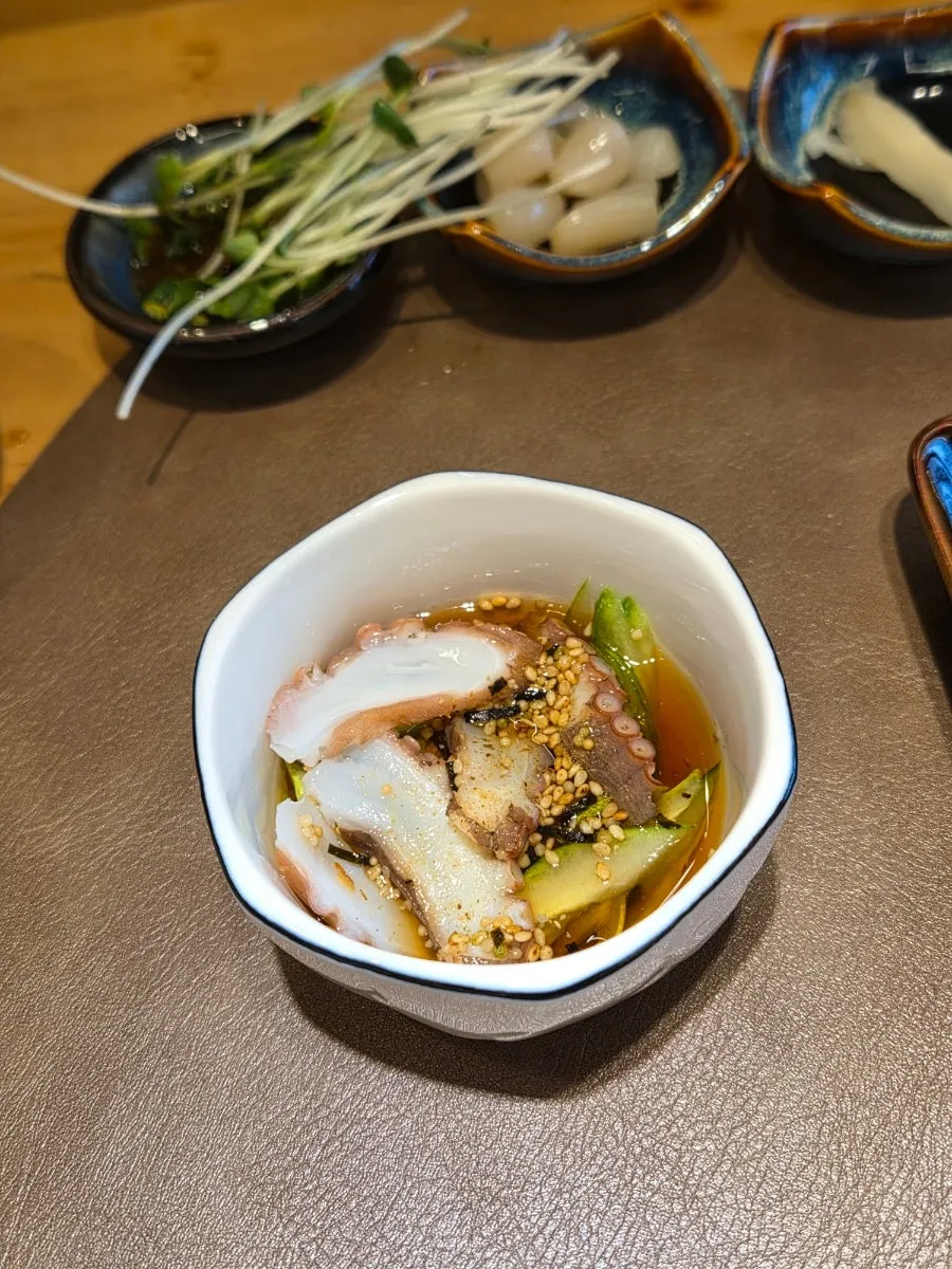 A slice of rockfish and red seabream sashimi