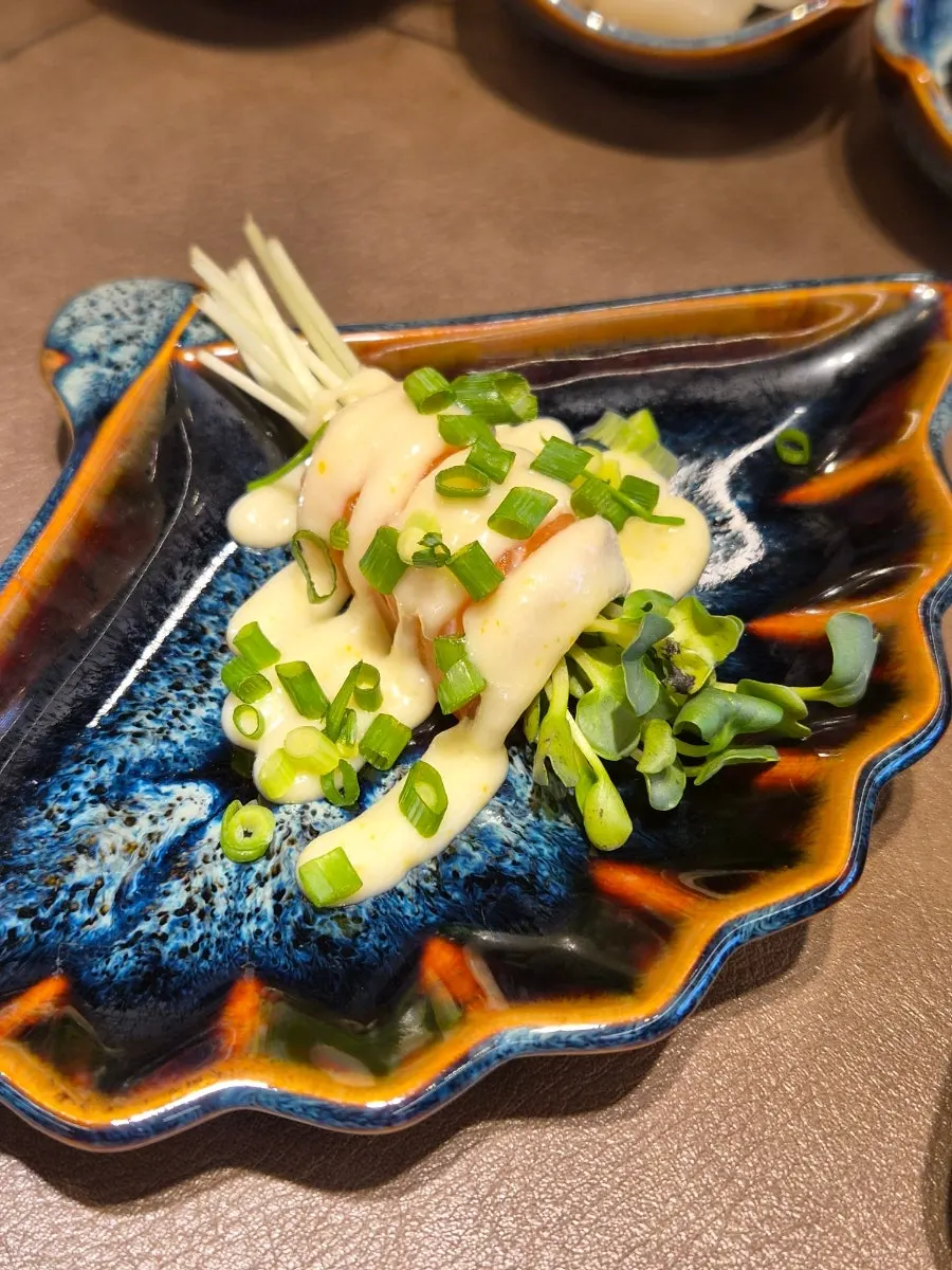 A dish of octopus served together with cucumber