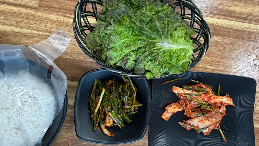 Eel table setting with shredded ginger and sauce
